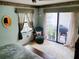 Bedroom featuring a private balcony with outdoor furniture and a grill at 8810 41St N St, Pinellas Park, FL 33782