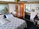 Well-lit bedroom with a queen-sized bed and mirrored closet doors at 8810 41St N St, Pinellas Park, FL 33782