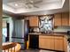 Bright kitchen featuring stainless steel appliances, natural wood cabinets, and a view to backyard at 8810 41St N St, Pinellas Park, FL 33782