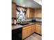 Efficient kitchen with stainless steel appliances and natural wood cabinetry at 8810 41St N St, Pinellas Park, FL 33782