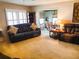 Bright living room with sofa and open view into the dining area at 8810 41St N St, Pinellas Park, FL 33782