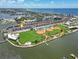 Aerial view of waterfront condos, ROC Park, baseball fields, and beach in Madeira Beach, Florida at 337 Rex Pl # E, Madeira Beach, FL 33708