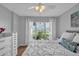 Cozy bedroom features bright natural light and serene decor at 337 Rex Pl # E, Madeira Beach, FL 33708