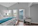 Bright bedroom features large windows with beach views and a dedicated workspace at 337 Rex Pl # E, Madeira Beach, FL 33708