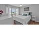 Cozy bedroom features bright natural light and serene decor at 337 Rex Pl # E, Madeira Beach, FL 33708