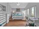 Bright bedroom with a vaulted ceiling, work desk, and windows with natural light at 337 Rex Pl # E, Madeira Beach, FL 33708