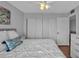 Comfortable bedroom features a ceiling fan, closet, and serene decor at 337 Rex Pl # E, Madeira Beach, FL 33708