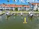View of condo boat slips featuring boat lifts, docks, and canal access at 337 Rex Pl # E, Madeira Beach, FL 33708