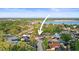 An aerial view of a cozy home nestled in a serene lakeside community at 10812 96Th St, Largo, FL 33773