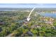Beautiful aerial view of property featuring mature trees and serene lakeside community at 10812 96Th St, Largo, FL 33773
