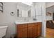 Bathroom features a modern vanity with a vessel sink, framed mirror, and adjacent toilet at 10812 96Th St, Largo, FL 33773
