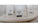 Bathroom featuring toiletries on a white shelf with decorative tile surround at 10812 96Th St, Largo, FL 33773