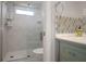 Bathroom with glass enclosed shower, decorative tile, and stylish vanity at 10812 96Th St, Largo, FL 33773