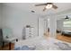 Bright bedroom features a ceiling fan, hardwood floors, closet and ensuite bathroom at 10812 96Th St, Largo, FL 33773