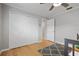 Bedroom with hardwood floors, closet, and ceiling fan at 10812 96Th St, Largo, FL 33773
