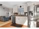 Well-lit kitchen features stainless appliances, sleek countertops, ample cabinetry, and convenient access to living area at 10812 96Th St, Largo, FL 33773