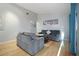 The open-concept living room is furnished with modern decor, artwork, and hardwood floors at 10812 96Th St, Largo, FL 33773