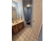 Cozy half-bathroom with toilet and vanity with mirror at 10825 Venice Cir, Tampa, FL 33635