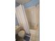Bathroom featuring a white shower curtain and fixtures, blue walls and floors at 10825 Venice Cir, Tampa, FL 33635