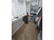 Spacious carpeted walk-in closet with built-in shelving and hanging rods for optimal storage at 10825 Venice Cir, Tampa, FL 33635