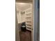 Walk-in closet with carpet and built-in shelving and hanging rods at 10825 Venice Cir, Tampa, FL 33635