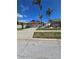 Charming single-story home with a well-maintained lawn and palm trees in a sunny neighborhood at 10825 Venice Cir, Tampa, FL 33635