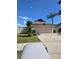 Well-manicured home with a two-car garage and a cozy front yard featuring vibrant green grass at 10825 Venice Cir, Tampa, FL 33635