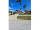 Charming single-level home boasting lush palm trees and a well-manicured front yard at 10825 Venice Cir, Tampa, FL 33635