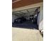 Spacious two-car garage with ample room for parking and storage, showcasing a car and storage items at 10825 Venice Cir, Tampa, FL 33635