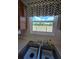 Close up of double sink and a view through the window to the backyard at 10825 Venice Cir, Tampa, FL 33635