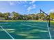 Well-maintained basketball courts in a park setting, providing ample space for recreational play and sports activities for all ages at 1211 Penny Ct, Dunedin, FL 34698