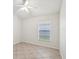 Bright bedroom with a ceiling fan and a window that allows natural light at 1211 Penny Ct, Dunedin, FL 34698