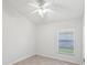 Bright bedroom with a ceiling fan and a window that allows natural light at 1211 Penny Ct, Dunedin, FL 34698