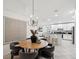Open dining area featuring contemporary decor and views of the kitchen and living area at 1211 Penny Ct, Dunedin, FL 34698