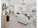 Bright living room featuring tile floors, white walls, lots of natural light, and a modern aesthetic at 1211 Penny Ct, Dunedin, FL 34698