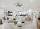 Spacious living space with a modern kitchen, comfortable seating, and plenty of natural light at 1211 Penny Ct, Dunedin, FL 34698