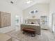 Spacious main bedroom with bench seating and double windows for natural light at 1211 Penny Ct, Dunedin, FL 34698