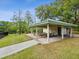 Covered picnic shelter featuring multiple picnic tables on a concrete slab at 1211 Penny Ct, Dunedin, FL 34698