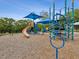 Blue and orange playground with slides and climbing structures, set in a park at 1211 Penny Ct, Dunedin, FL 34698