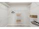 Spacious walk-in closet with extensive shelving and storage solutions at 1211 Penny Ct, Dunedin, FL 34698