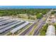 Attractive aerial shot featuring real estate property, nearby roads, manicured lawns, and a beautiful view of the adjacent bay at 12400 Park Blvd # 121, Seminole, FL 33772
