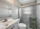 Updated bathroom featuring glass shower door and white vanity cabinet sink at 12400 Park Blvd # 121, Seminole, FL 33772