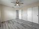 Bright bedroom with modern flooring, neutral walls, and ample closet space, perfect for relaxation at 12400 Park Blvd # 121, Seminole, FL 33772