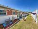 Charming exterior with manicured landscaping and a welcoming outdoor area at 12400 Park Blvd # 121, Seminole, FL 33772