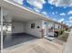 Property with a covered carport with lighting and a neat front entrance featuring brick accents at 12400 Park Blvd # 121, Seminole, FL 33772