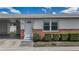 Charming home featuring a white front door, adjacent carport, and well-maintained landscaping at 12400 Park Blvd # 121, Seminole, FL 33772