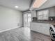 Bright kitchen featuring white cabinets, contrasting countertops and seamless access to outdoor space via sliding doors at 12400 Park Blvd # 121, Seminole, FL 33772