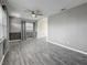 Comfortable living room with durable wood-look flooring and plenty of natural light at 12400 Park Blvd # 121, Seminole, FL 33772