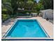 A beautiful community pool with refreshing turquoise-blue water and surrounding deck and plenty of space for outdoor enjoyment at 12400 Park Blvd # 121, Seminole, FL 33772