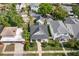 Home with manicured lawn, a detached garage, beautiful trees, and a well-maintained roof at 1511 47Th N Ave, St Petersburg, FL 33703